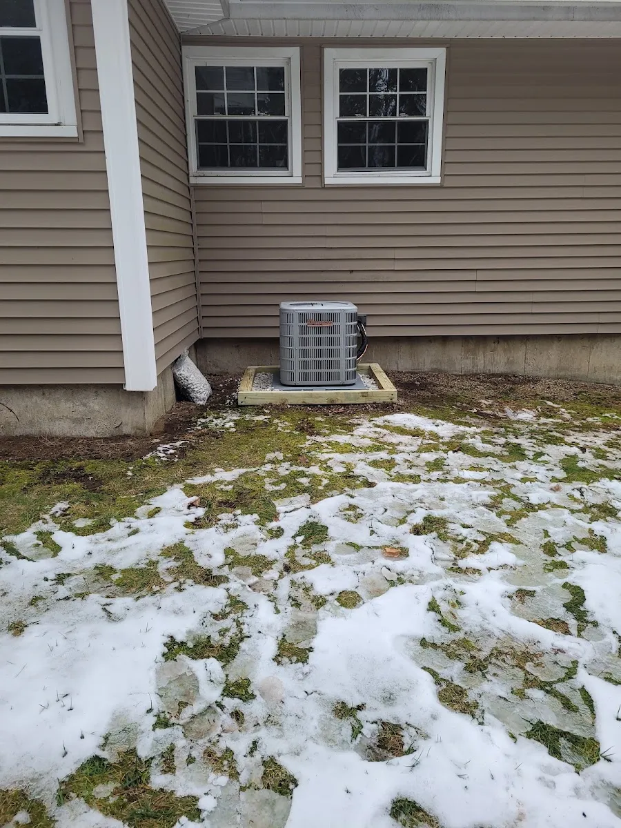 Central air conditioning — Central AC condenser installed on a solid pad for reliable summer cooling.