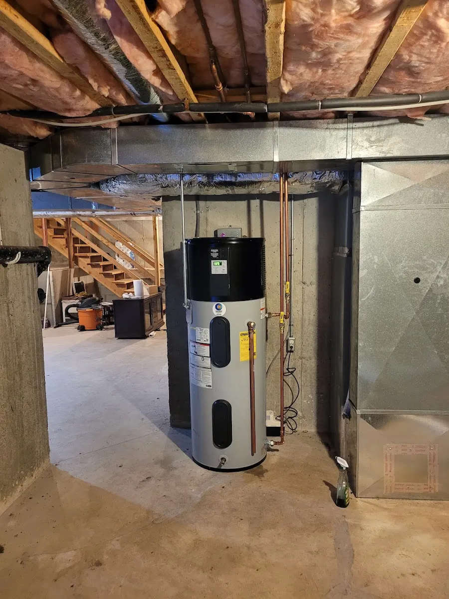 Hybrid heat pump water heater — Energy-saving hybrid heat pump water heater installed and tied into the home’s plumbing.