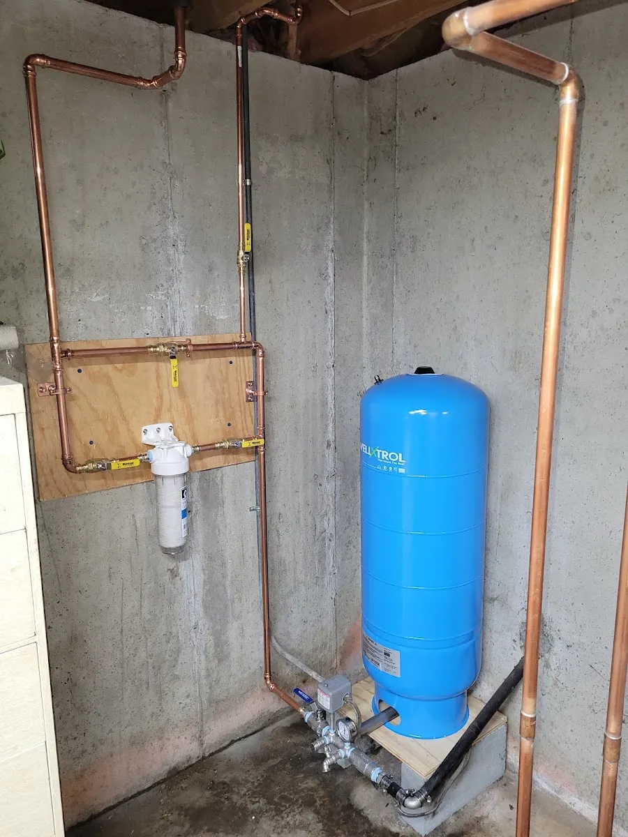 Well water pressure system — Well pressure tank, filtration and copper piping serviced for steady, clean water.
